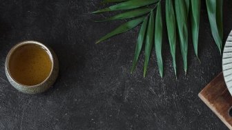 Image of tea pot against black background