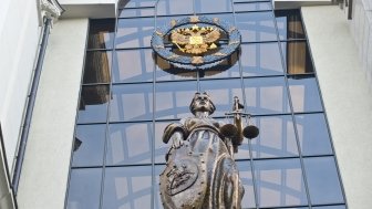 Statue depicting justice outside the Russian Supreme Court building 