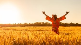 Woman Facing Rising Sun