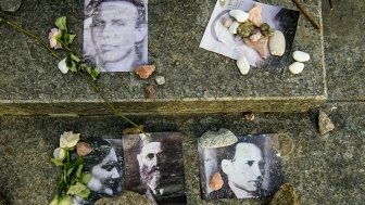 Portraits of killed Jews near Menorah monument in Memory of Jews Victims at the Babyn Yar National Historical Memorial. October 2020 Kyiv, Ukraine.