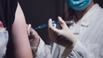 Person receives COVID-19 vaccine