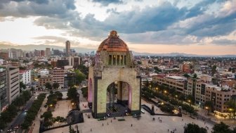 Aerial view of city centre including historical landmark Monument to the Revolution located at Plaza de La Republica in Mexico City, Mexico.