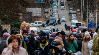 February 26, 2022: Refugees are waiting for permission to cross the border into Europe through the Ukrainian-Slovak border.