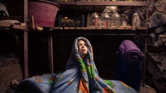 Ukrainian child takes shelter in her basement