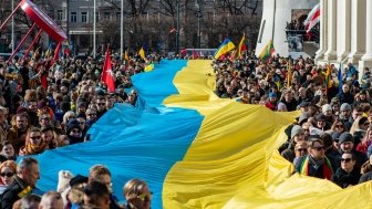 parade with large ukraine flag