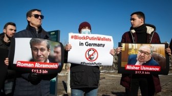 Activists holding signs