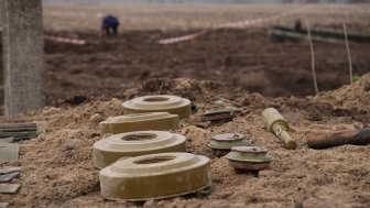 Demining by troops of the territory. Many mines, shells, artillery, grenades, fragmentation grenades