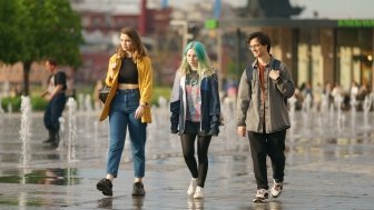 Moscow, Russia - June 1, 2022: Teenagers walking across the dry fountains.