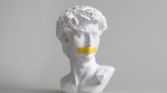 Michelangelo's David head bust with duct tape sealed mouth. 