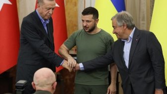 Zelensky, Erdogan, and Guterres shaking hands