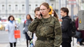 Russian Soldier talking on a phone