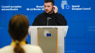 Zelenskyy on a podium at an event 