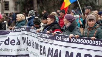 Group of protesters holding long banner