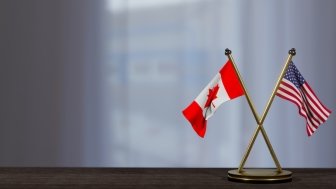 Canadian and US Flags on a Table