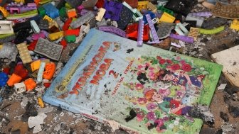 Ukrainian Children's Book on top of rubble