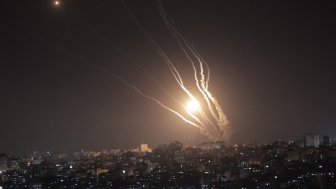 Smoke trails from rockets fired from Gaza at night