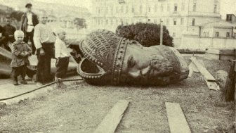 Historical photo of a toppled statue 