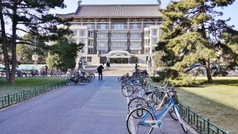 An image of Peking University's library with bicycles nearby