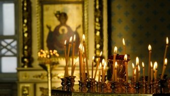 Candles are lit at an Orthodox Church