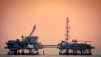 Oil platform silhouette in Gulf of Mexico