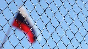 The Russian flag behind fence