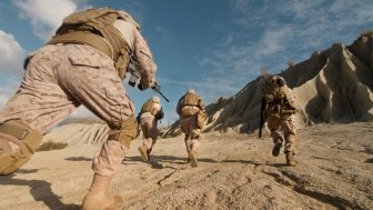 Close-up Shot of Squad of Soldiers Running Forward and Atacking Enemy During Military Operation in the Desert.