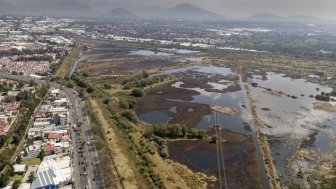 Aerial view of water regulation pond in the urban area of Mexico City