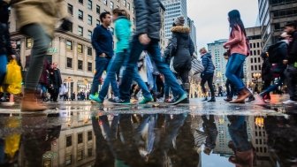 People walking fast during shipping hour on Ste-Catherine Street in Montreal, Canada