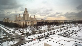 Main building of Moscow State University at winter in Moscow, Russia, view through window