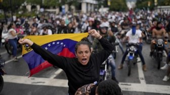 Protesters demonstrate against the official election results declaring President Nicolas Maduro's reelection, the day after the vote in Caracas, Venezuela, Monday, July 29, 2024. (