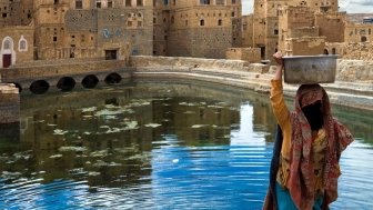 An unidentified woman uses a public fountain basin on May 5, 2007 in Thula, Yemen. Among other arabic countries, in 2012 Yemen became a site of civil conflicts.