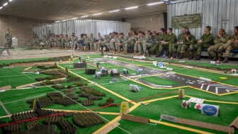 U.S. Army, Royal Canadian Regiment and Italian Esercito soldiers are briefed on the upcoming operations a part of Steadfast Javelin II on Rhein Ordnance Barracks, Germany, Sept. 3, 2014.