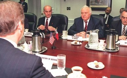 Secretary of Defense William S. Cohen (left, back to camera) meets with a delegation from Georgia led by President Eduard Shevardnadze (center), and including, among others, Minister of Foreign Affairs Irakli Menagarishvili (left, facing camera), and Mr. Charkviani, head of the Foreign Relations Department, serving here as interpreter (right). 