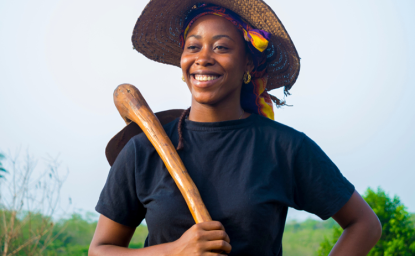 A young African lady working on a farm