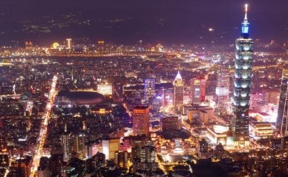 An aerial view of the city of Taipei at night.