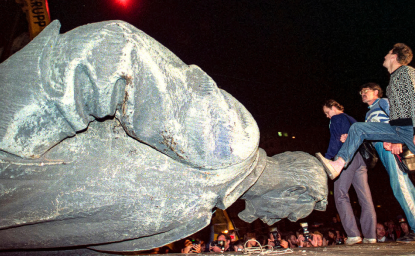 In this Friday, August 23, 1991 file photo, people kick the head of the statue of Felix Dzerzhinsky, the founder of the Soviet secret police, in front of the KGB main headquarters on Lubyanka Square in Moscow, Russia. The statue was pulled down after the defeat of the August 1991 hardline coup. This was a watershed moment that symbolized the collapse of the repressive Soviet system.