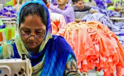 A woman worker manufactures a garment in a project benificiary factory - women constuitute a significant portion of the workforce in Pakistan's garment industry