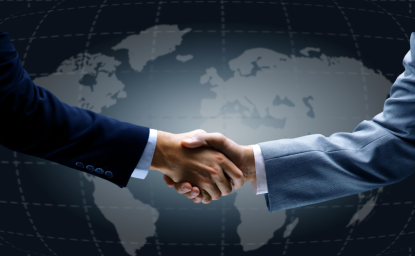 Handshake in front of world map