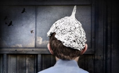 Young person wearing a tin foil hat