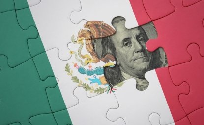 puzzle with the colourful national flag of mexico and usa dollar banknote. finance concept