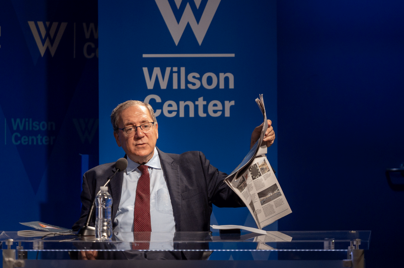 David Sanger holding up a newspaper 