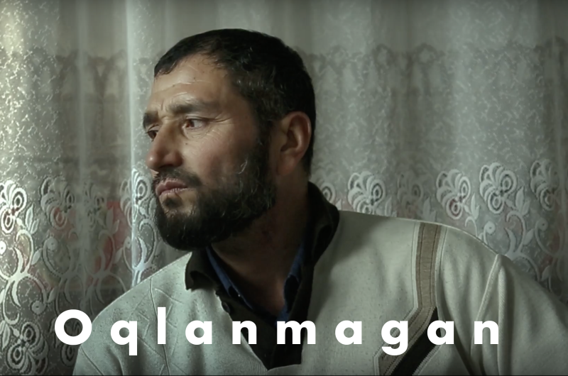 still from film Oqlanmagan with title overlaid