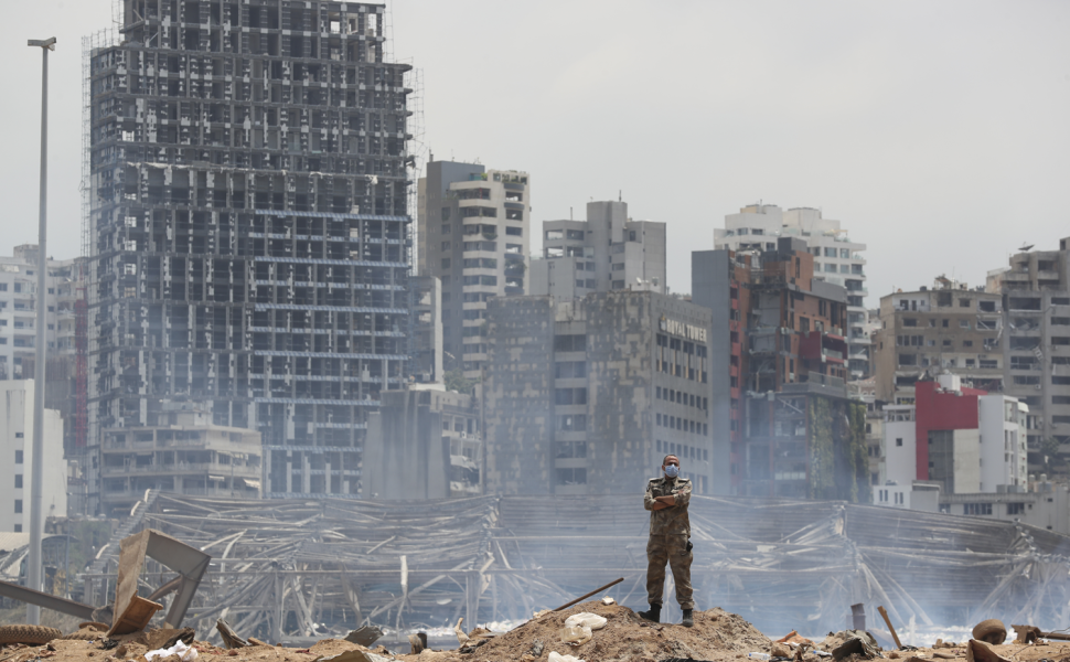 A soldier stands at the devastated site of the explosion in the port of Beirut, Lebanon, 