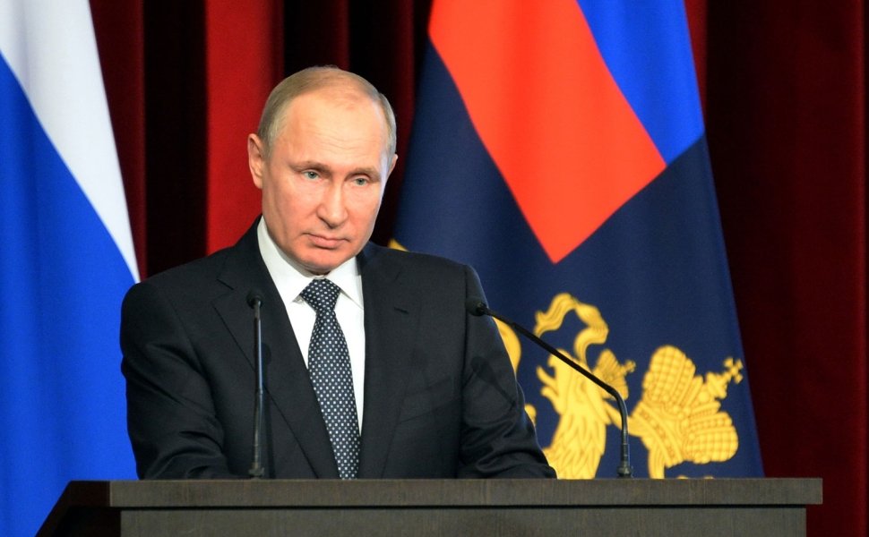 Vladimir Putin with flags behind