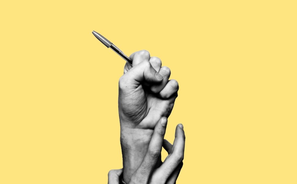 Concept of freedom of speech and information, stop censorship. Hand holding an open pen. It is dragged down by another hand. Black and white subject with a yellow background