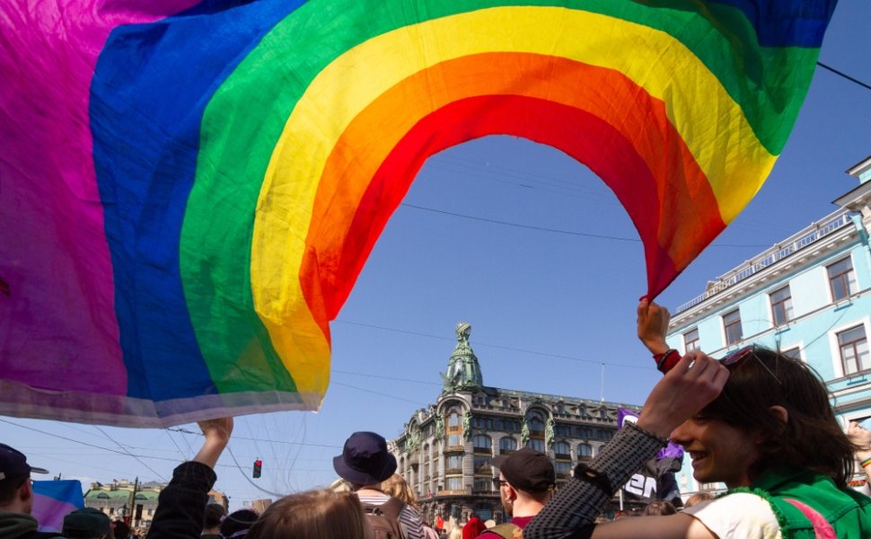 Saint-Petersburg, Russia - May 01, 2019: May demonstration. Marchers with a rainbow LGBT flag on Nevsky prospect.