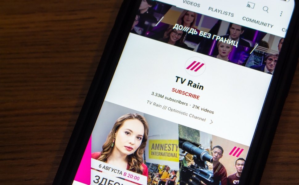 A phone screen depicting the Youtube channel of Russian-language independent television channel TV Rain, also known as Dozhd