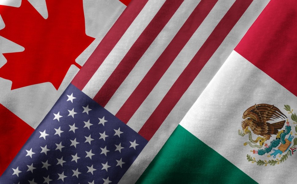 Close up of the flags of the North American Free Trade Agreement NAFTA members on textile texture. NAFTA is the world's largest trade bloc and member countries are Canada, United States and Mexico.