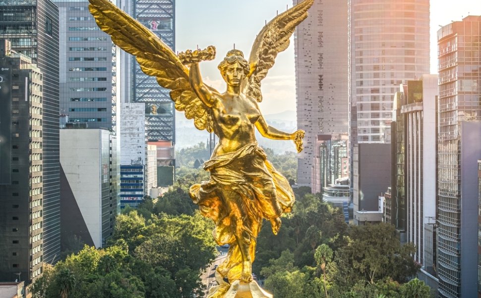  Mexico City - September 28, 2023: Aerial front view of the the Angel of Independence on Paseo de la Reforma during sunset