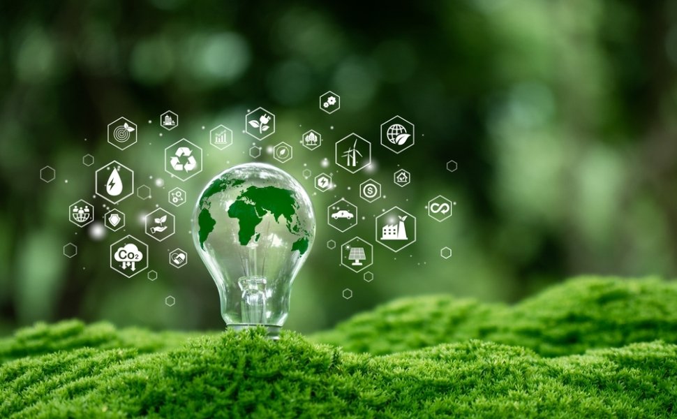 Green map in light bulb with renewable energy icon. Carbon emission low neutral, net zero, ESG, sustainable Environment.green energy. World Environment Day. Green business.